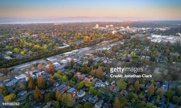 aerial: menlo park suburbs in silicon valley at sunset - birthplace of silicon valley stockfoto's en -beelden