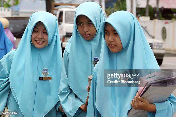 Female Muslim students walk to school in Kota Bharu, Kelantan, Malaysia, on Thursday, Sept. 10, 2009. Growing Islamic conservatism in Malaysia's...