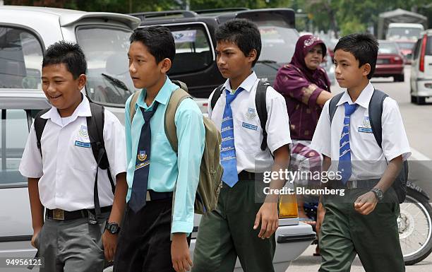 Male students walk to school in Kota Bharu, Kelantan, Malaysia, on Thursday, Sept. 10, 2009. Growing Islamic conservatism in Malaysia's Kelantan...