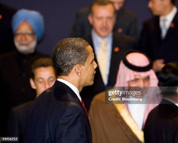 President Barack Obama, center, arrives for the second family photograph at the G20 London Summit in London, U.K., on Thursday, April 2, 2009. World...