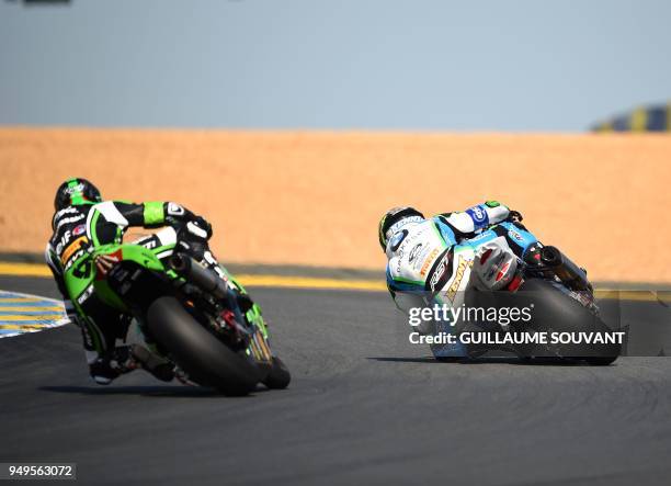 Rider Kenny Foray on BMW Formula EWV N°48 competes for the first place with French rider Randy de Puniet on Kawasaki ZX10R Formula EWC N°11 during...