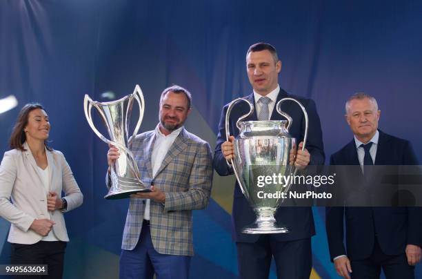 Mayor of Kiev Vitali Klitschko and President Ukrainian soccer federation Andriy Pavelko , hold the Champions league trophies at the hand over...