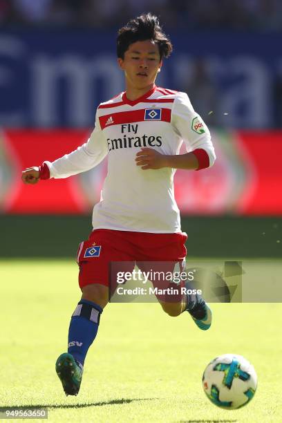 Tatsuya Ito of Hamburg runs with the ball during the Bundesliga match between Hamburger SV and Sport-Club Freiburg at Volksparkstadion on April 21,...