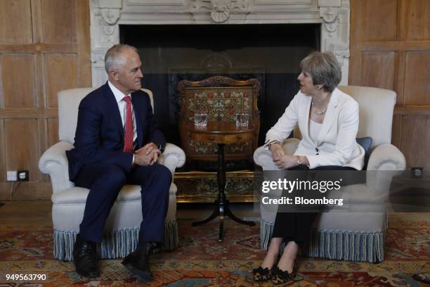 Malcolm Turnbull, Australia's prime minister, left, listens as Theresa May, U.K. Prime minister, speaks during a meeting at Chequers, Aylesbury,...