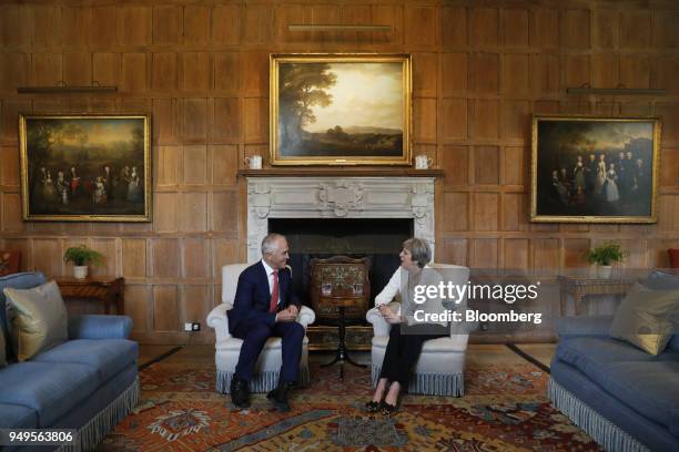 Malcolm Turnbull, Australia's prime minister, left, reacts as Theresa May, U.K. Prime minister, speaks during a meeting at Chequers, Aylesbury, U.K.,...