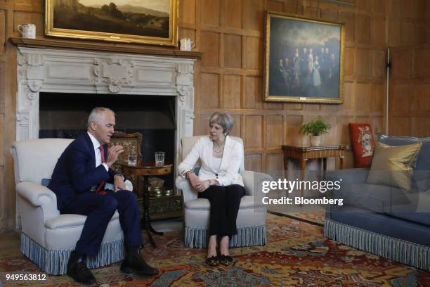 Malcolm Turnbull, Australia's prime minister, left, gestures while speaking as Theresa May, U.K. Prime minister, listens during a meeting at...