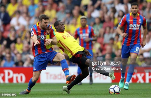 Abdoulaye Doucoure of Watford is challenged by James McArthur of Crystal Palace during the Premier League match between Watford and Crystal Palace at...