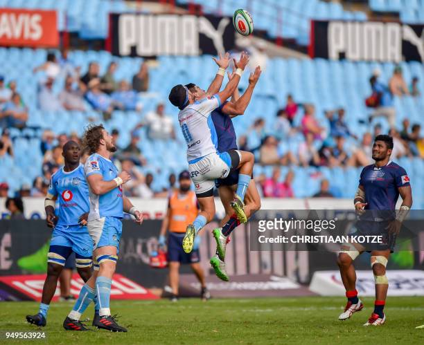 Divan Rossouw of the Vodacom Bulls and Jack Maddocks of the Rebels jump for the high ball during their Super Rugby 2018 match between the Bulls and...