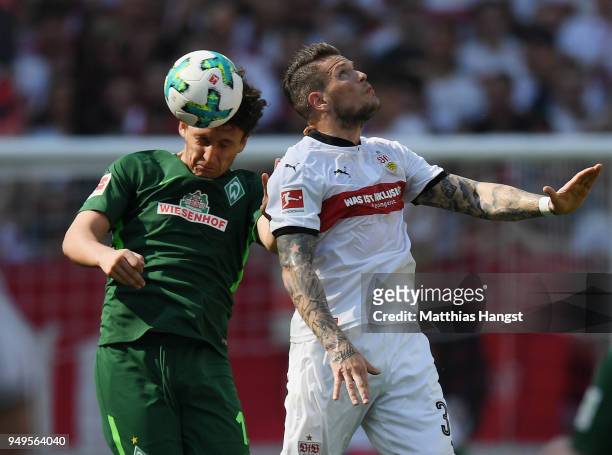 Milos Veljkovic of Bremen jumps for a header with Daniel Ginczek of Stuttgart during the Bundesliga match between VfB Stuttgart and SV Werder Bremen...