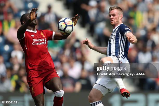 Sadio Mane of Liverpool and Chris Brunt of West Bromwich Albion during the Premier League match between West Bromwich Albion and Liverpool at The...