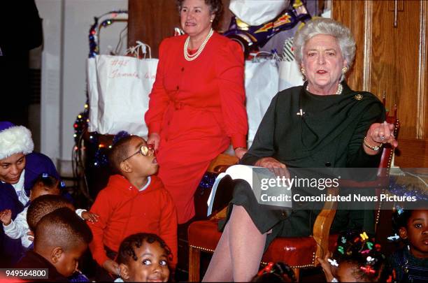 First Lady Barbara Bush attends a Christmas Party for children at the Central Union Mission homeless shelter, Washington DC, December 13, 1989.