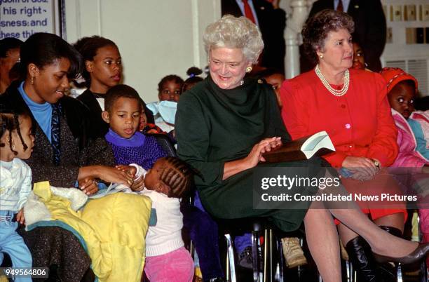 First Lady Barbara Bush attends a Christmas Party for children at the Central Union Mission homeless shelter, Washington DC, December 13, 1989.