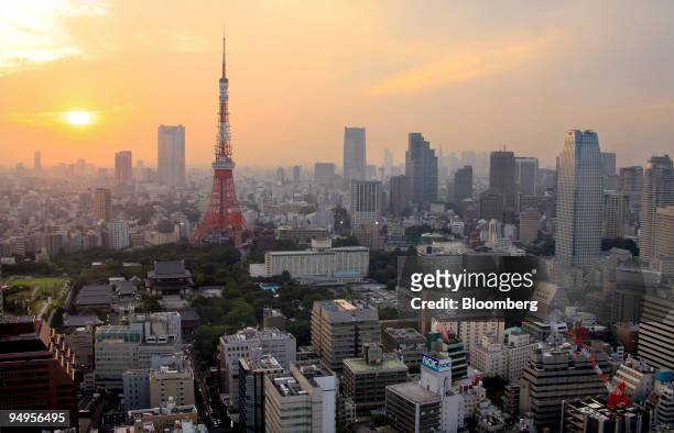 The Tokyo Tower stands amid buildings at dusk in Tokyo, Japan, on Friday, Sept. 11, 2009. In Tokyo, Japan, on Thursday, Sept. 17, 2009. Tokyo is...