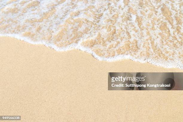 soft wave on sandy beach with white coral. background. selective focus. abstract sand on the beach and soft wave background - sabbia foto e immagini stock