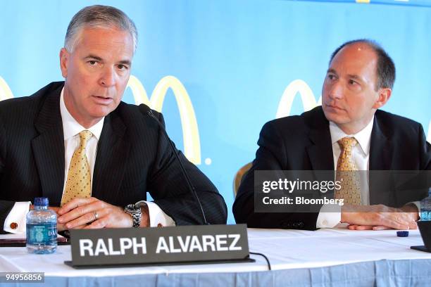 Peter Bensen, executive vice president and chief financial officer of McDonald's Corp., right, listens to Ralph Alvarez, the company's president and...