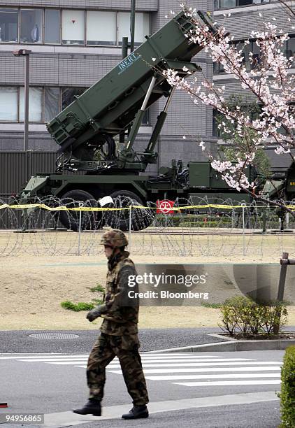 Japanese Self-Defense Force soldier walks near a Patriot Advanced Capability-3 missile unit at the Ministry of Defense, in Tokyo, Japan, on Sunday,...