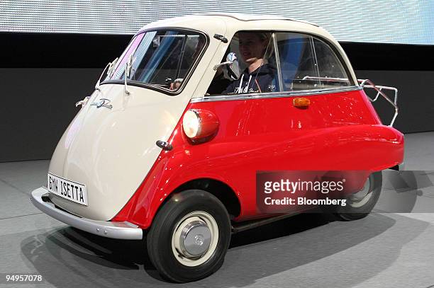 Driver tests a vintage BMW Isetta automobile prior to the opening of the Frankfurt Motor Show, in Frankfurt, Germany, on Monday, Sept. 14, 2009....