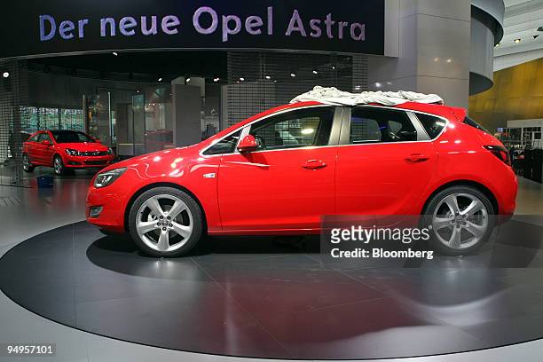 The new Opel Astra automobile sits on display prior to the opening of the Frankfurt Motor Show, in Frankfurt, Germany, on Monday, Sept. 14, 2009....
