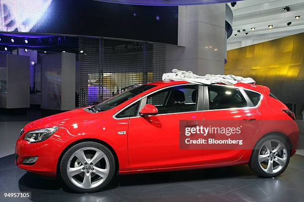The new Opel Astra automobile sits on display prior to the opening of the Frankfurt Motor Show, in Frankfurt, Germany, on Monday, Sept. 14, 2009....