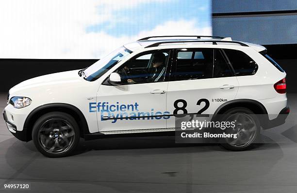 An employee drives a BMW 116d Vision Efficient Dynamics automobile prior to the opening of the Frankfurt Motor Show, in Frankfurt, Germany, on...