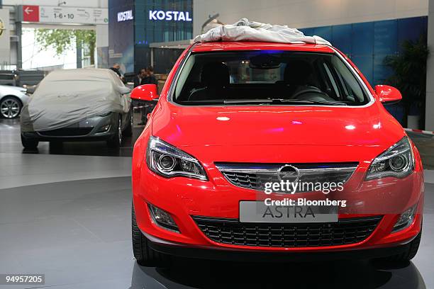 New Opel Astra automobile sits on display prior to the opening of the Frankfurt Motor Show, in Frankfurt, Germany, on Monday, Sept. 14, 2009. Opel...