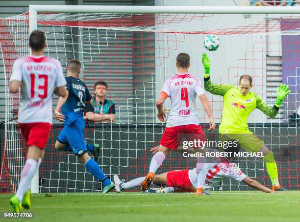 Hoffenheim's Czech defender Pavel Kaderabek scores the third goal past Leipzig's Hungarian goalkeeper Peter Gulacsi during the German first division...