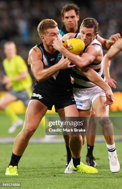 Ollie Wines of Port Adelaide and Joel Selwood of the Cats during the round five AFL match between the Port Adelaide Power and the Geelong Cats at...