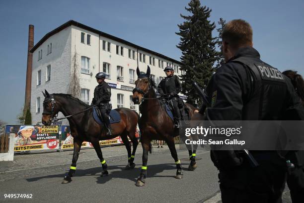 Mounted police patrol outside the venue of a neo-Nazi music fest on April 21, 2018 in Ostritz, Germany. By earky afternoon approximately 500...