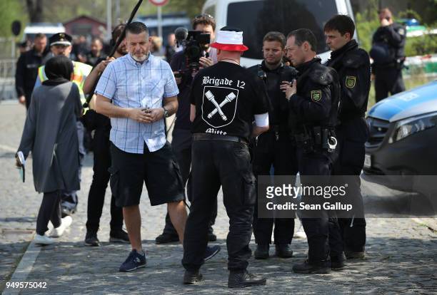 Event organizer Thorsten Heise speaks with police outside the venue of a neo-Nazi music fest on April 21, 2018 in Ostritz, Germany. By earky...