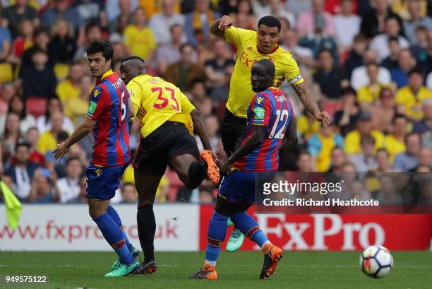 Troy Deeney of Watford shoots during the Premier League match between Watford and Crystal Palace at Vicarage Road on April 21, 2018 in Watford,...