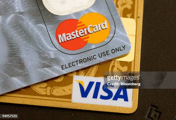 Visa and MasterCard credit cards are arranged for a photo in Toronto, Ontario, Canada, on Thursday, May 21, 2009. Canada will introduce new...