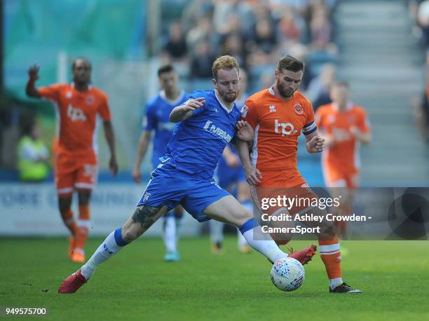 Gillingham's Connor Ogilvie battles with Blackpool's Jimmy Ryan during the Sky Bet League One match between Gillingham and Blackpool at Priestfield...
