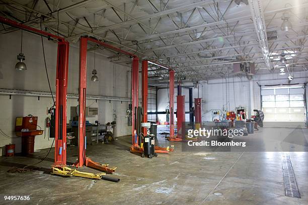 Hydraulic lifts sit idle in the service department of the closed Medved Chrysler Jeep Dodge dealership in Castle Rock, Colorado, U.S., on Tuesday,...