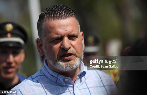 Event organizer Thorsten Heise arrives to speak to the media at the venue of a neo-Nazi music fest on April 21, 2018 in Ostritz, Germany. By early...
