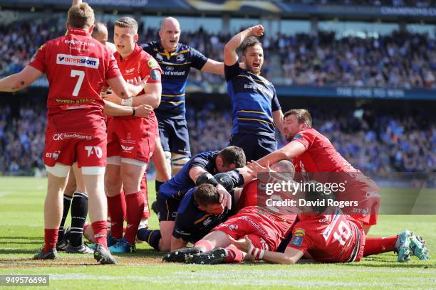 Leinster celebrate as James Ryan dives over for the first try during the European Rugby Champions Cup Semi-Final match between Leinster Rugby and...