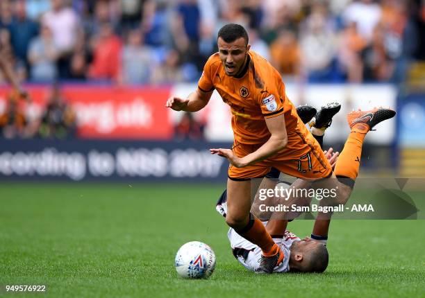 Romain Saiss of Wolverhampton Wanderers and Darren Pratley of Bolton Wanderers during the Sky Bet Championship match between Bolton Wanderers and...