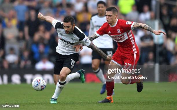 Bradley Johnson of Derby County is tackled by Muhamed Besic of Middlesbrough during the Sky Bet Championship match between Derby and Middlesbrough at...