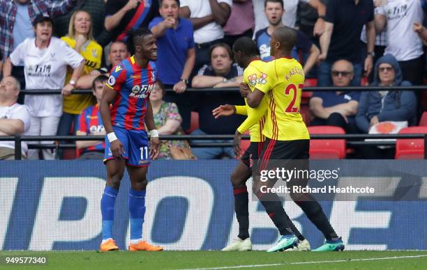 Wilfried Zaha of Crystal Palace clashes with Abdoulaye Doucoure of Watford during the Premier League match between Watford and Crystal Palace at...