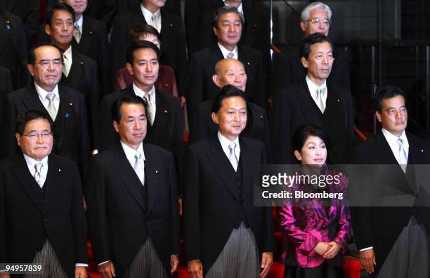 Yukio Hatoyama, Japan's prime minister, center, poses for a photograph with his newly appointed cabinet members at the prime minister's official...