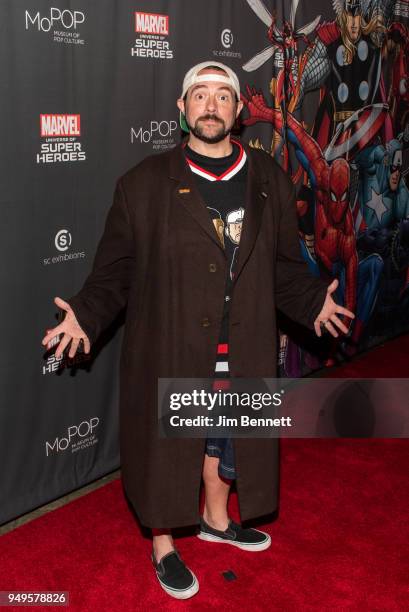 Filmmaker, actor, comic book writer, author, and podcaster Kevin Smith walks the red carpet at the opening of the Marvel: Universe of Super Heroes...