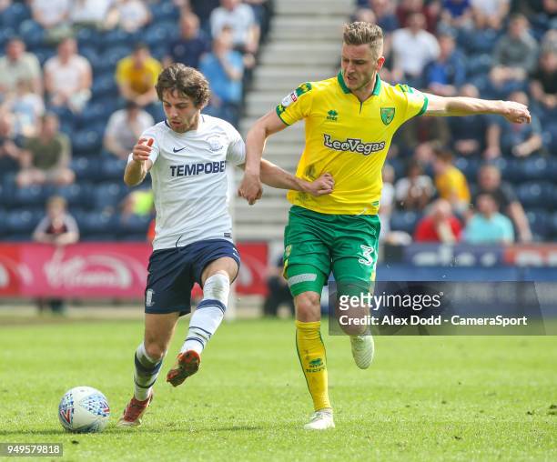 Preston North End's Ben Pearson holds off the challenge from Norwich City's Dennis Srbeny during the Sky Bet Championship match between Preston North...