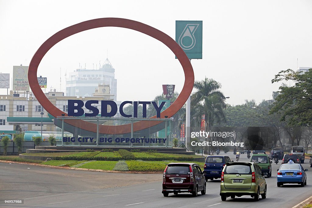 Traffic drives past the front gate of PT Bumi Serpong Damai'
