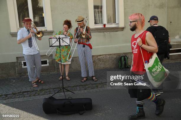 Street musicians play at a counter music and culture fest coinciding with a nearby neo-Nazi music fest on April 21, 2018 in Ostritz, Germany. By...