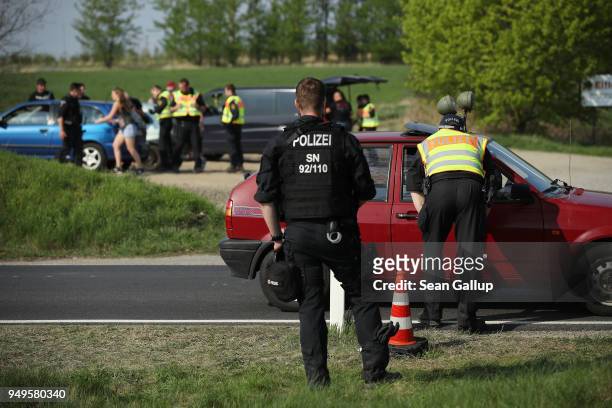 Police check cars arriving at the village outskirts during a neo-Nazi music fest on April 21, 2018 in Ostritz, Germany. By early afternoon...