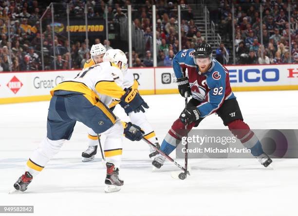 Gabriel Landeskog of the Colorado Avalanche skates against Austin Watson of the Nashville Predators in Game Four of the Western Conference First...