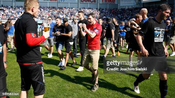 The Team and the Fans of Paderborn celebrate after the 3. Liga match between SC Paderborn 07 and SpVgg Unterhaching at Benteler Arena on April 21,...
