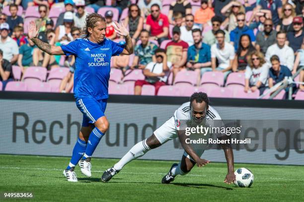 Michel Salgado vies with Michael Essien during the UEFA Match for Solidarity at Stade de Geneva on April 21, 2018 in Geneva, Switzerland.