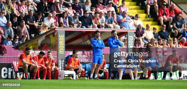 Lincoln City manager Danny Cowley, left, and Lincoln City's assistant manager Nicky Cowley watch inform the technical area during the Sky Bet League...