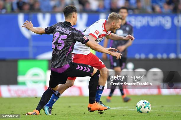 Robin Koch of Freiburg fights for the ball with Aaron Hunt of Hamburg during the Bundesliga match between Hamburger SV and Sport-Club Freiburg at...