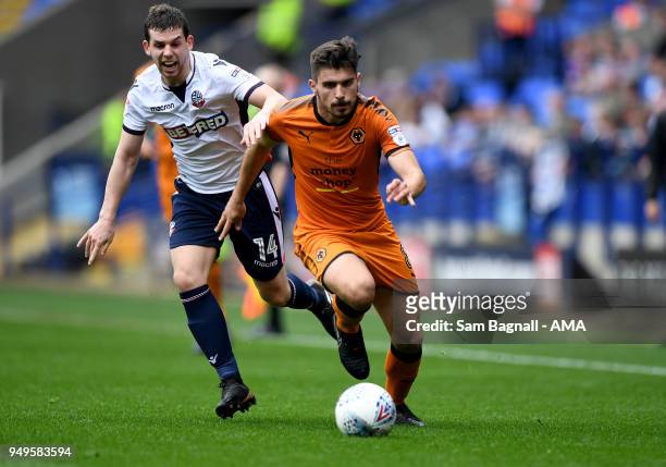 Jon Flanagan of Bolton Wanderers and Ruben Neves of Wolverhampton Wanderers during the Sky Bet Championship match between Bolton Wanderers and...
